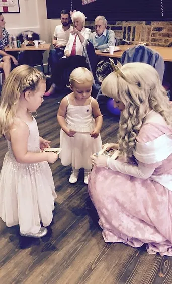 Princess Academy performer with children